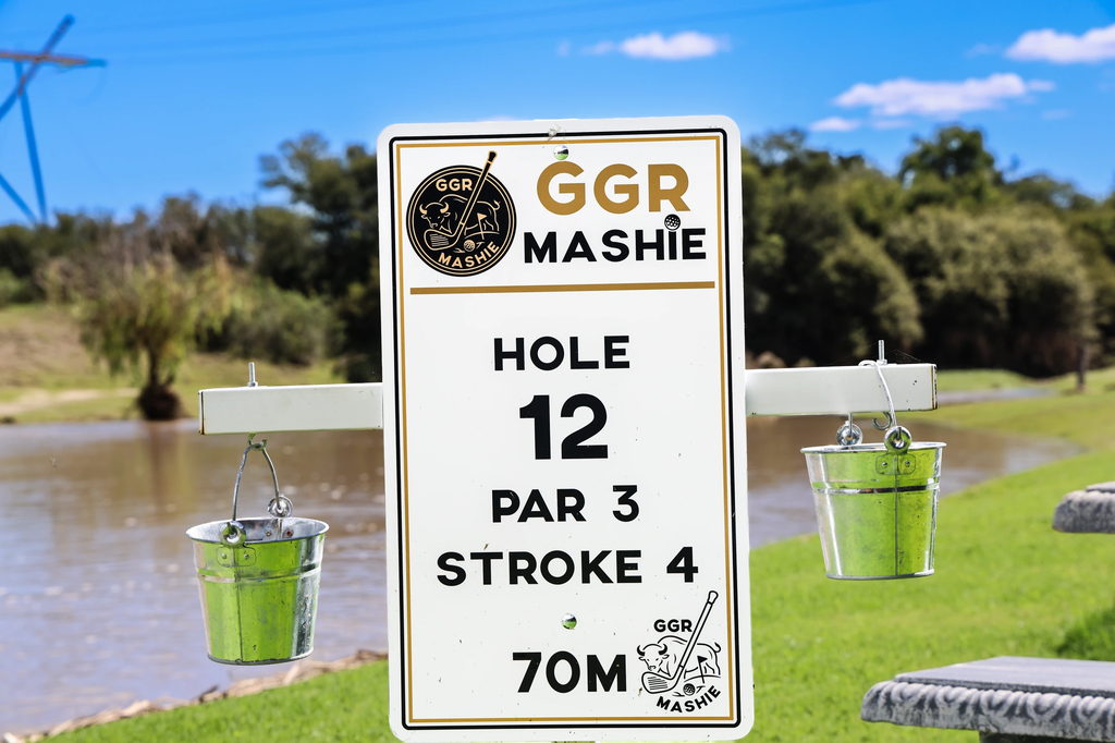 A GGR Mashie hole marker beside the water on the Goldfields golf course.